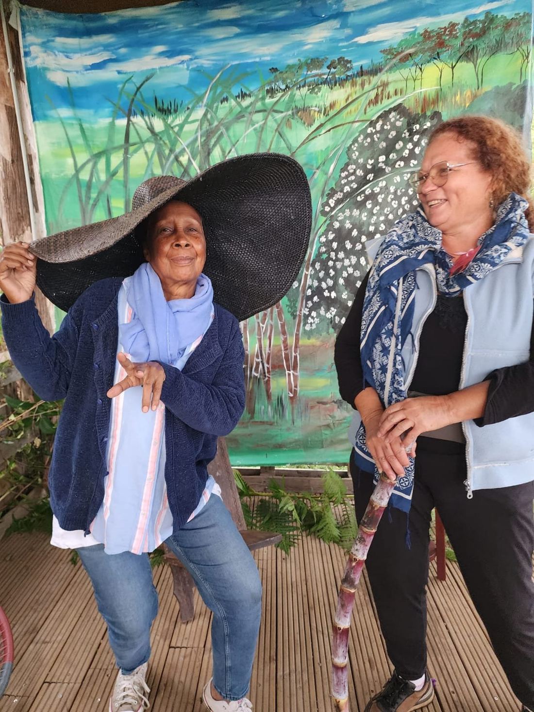Two guests laughing together at the market