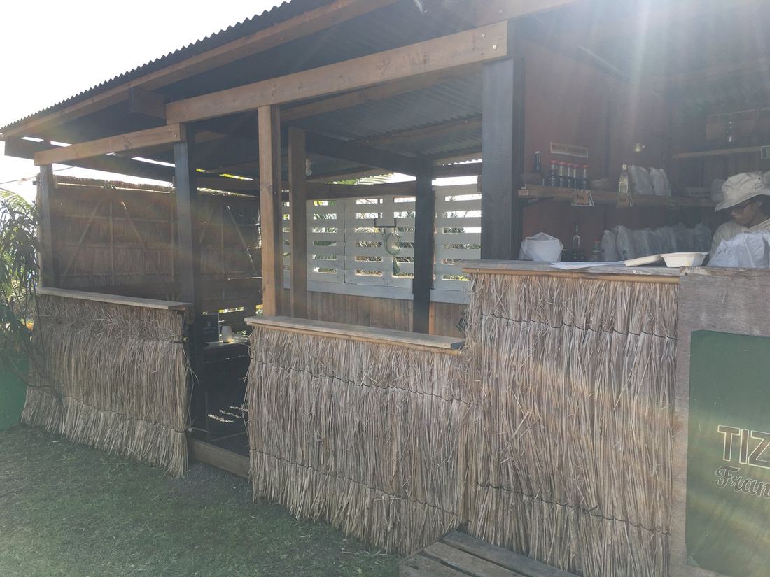 Another view of the market's thatched-roof bar