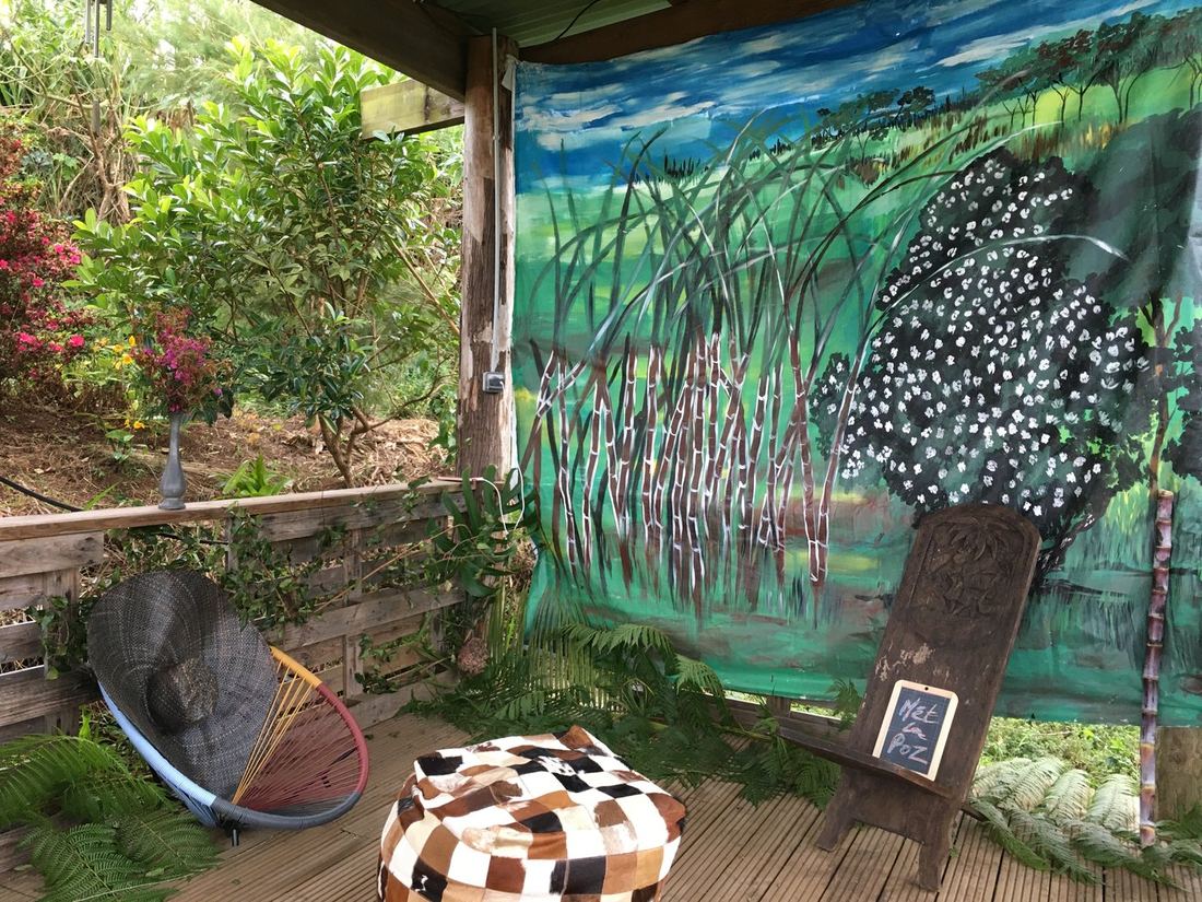 A quiet seating nook in front of the painted mural