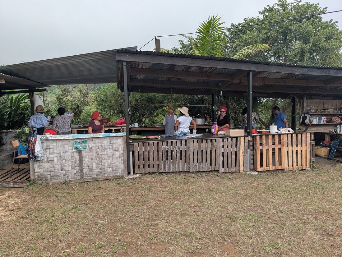 Exhibitors cooking together in the market kitchen