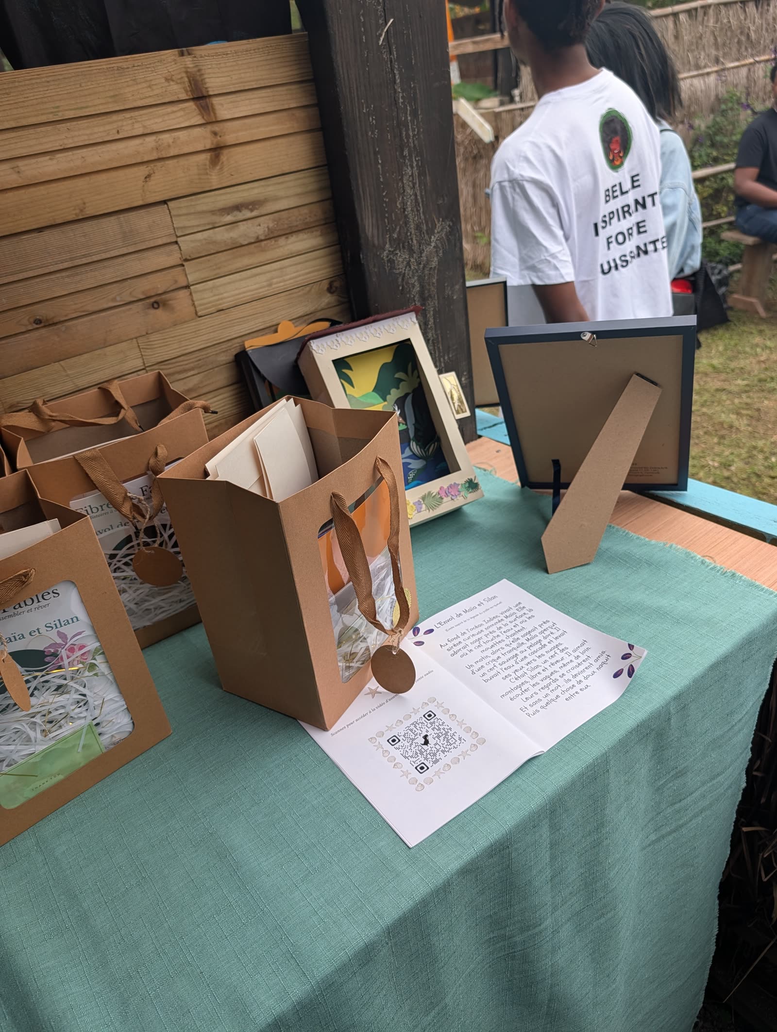 Packaging — kraft gift bag with story booklet and QR code